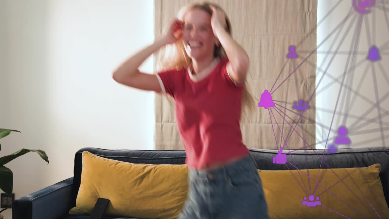 Woman placing phone on couch, reacting to text, dancing, purple tech overlay syncing with movements