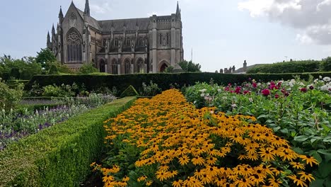 vibrant flowers in front of historic castle