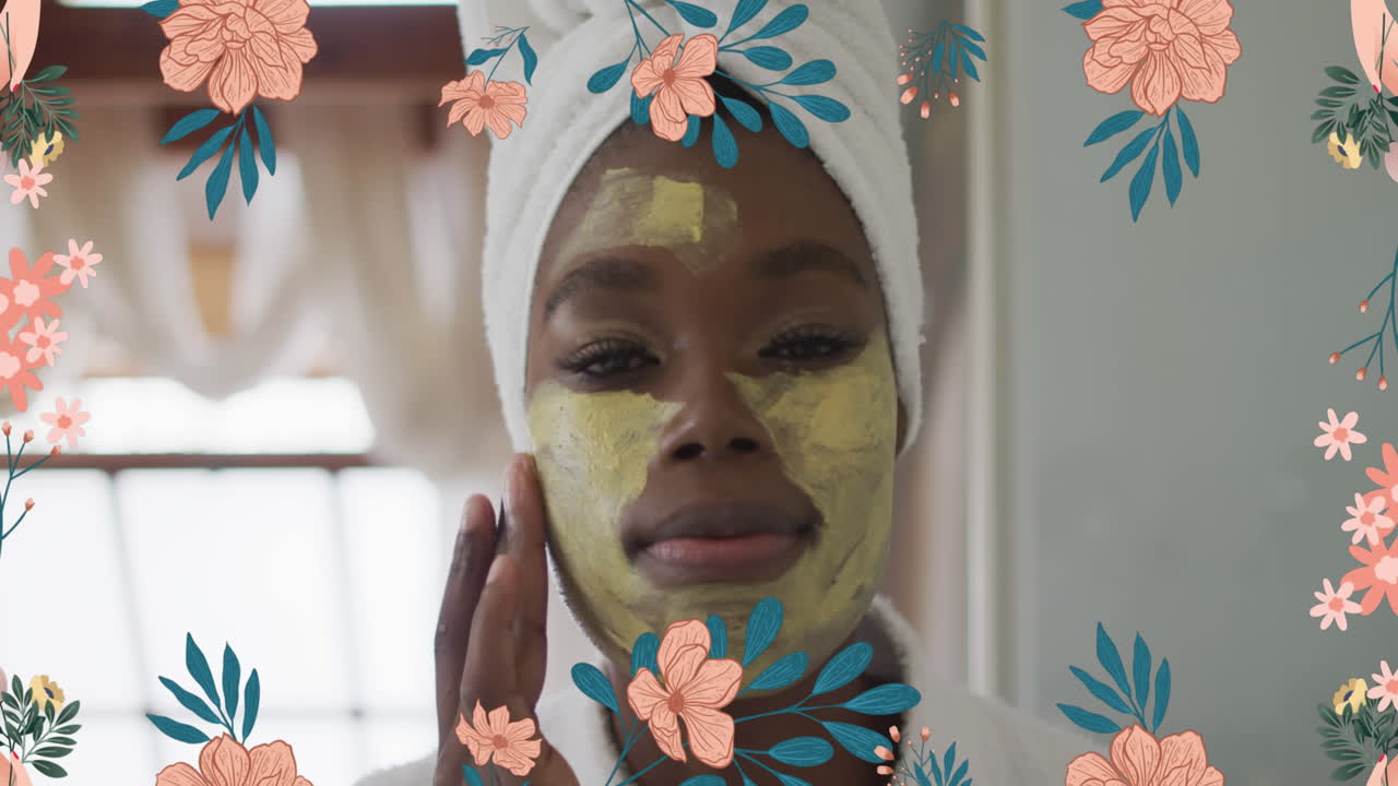 animación de flores sobre mujer afroamericana haciendo maquillaje