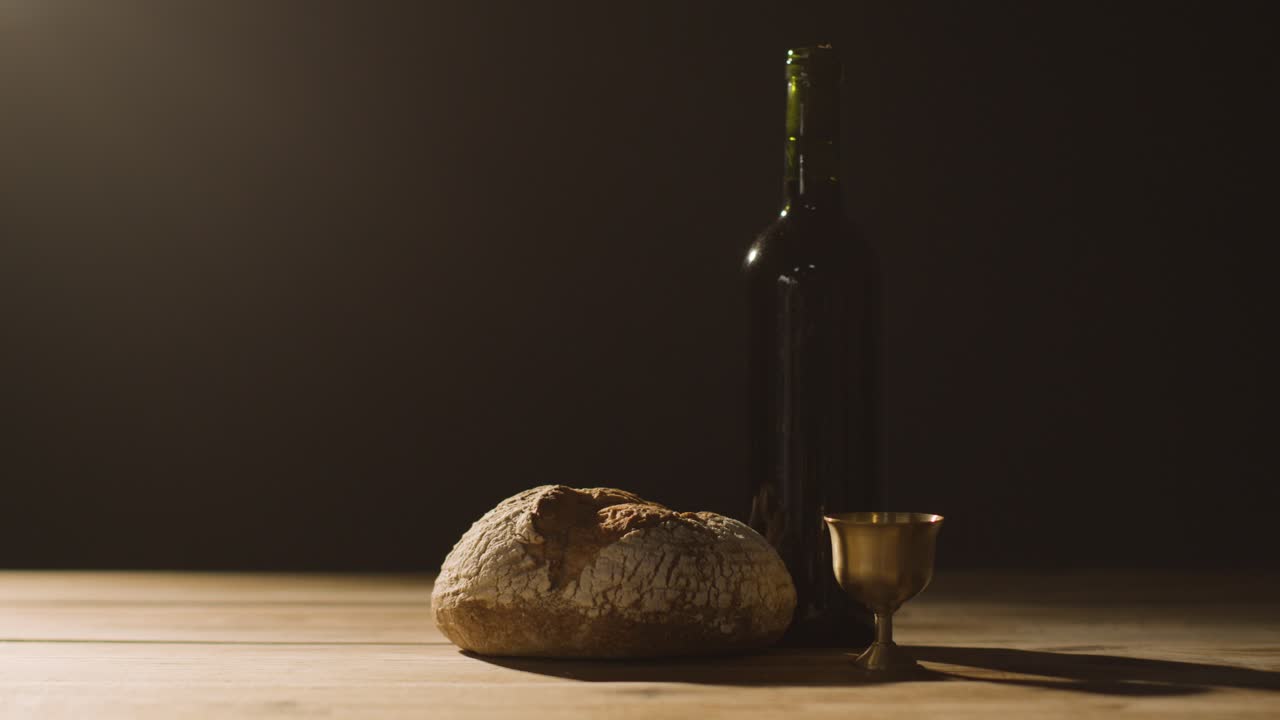 Religious Concept Shot With Chalice Bread And Wine On Wooden Altar With Pool Of Light 4