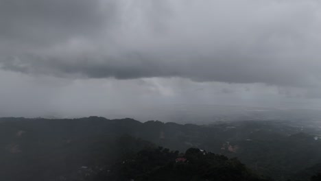cebu city panorama covered in heavy storm rain clouds