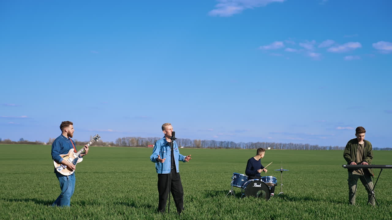 Music band plays in nature. Musical group band playing song performing on nature