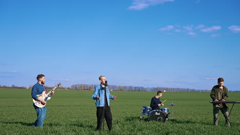 music band plays in nature. musical group band playing song performing on nature