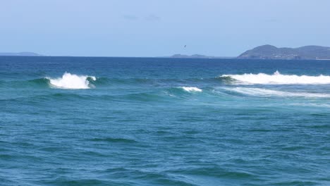 consistent waves breaking along a coastal line