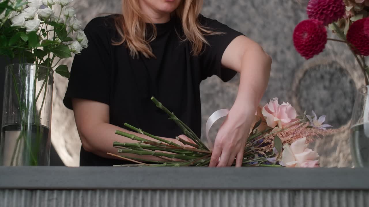 Woman Arranging a Beautiful Flower Bouquet
