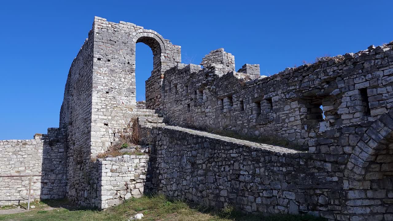 Ancient Stone Surrounding Walls: Berat Castle's Arched Windows and Robust Stones Defending the Old City Fortress