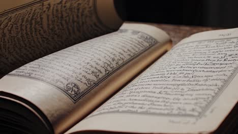 the video captures an ancient book in dim light, emphasizing mystery and history, with a close-up