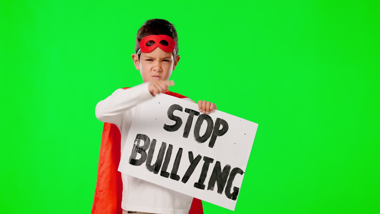 Superhero, stop bullying and boy with sign