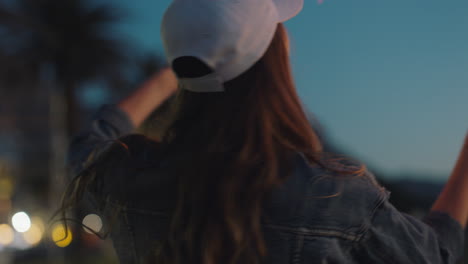 dancing-teenage-girl-with-sparklers-on-beach-at-sunset-celebrating-new-years-eve-having-fun-independence-day-celebration-with-fireworks-enjoying-freedom