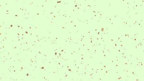 animación de confeti dorado sobre un fondo verde