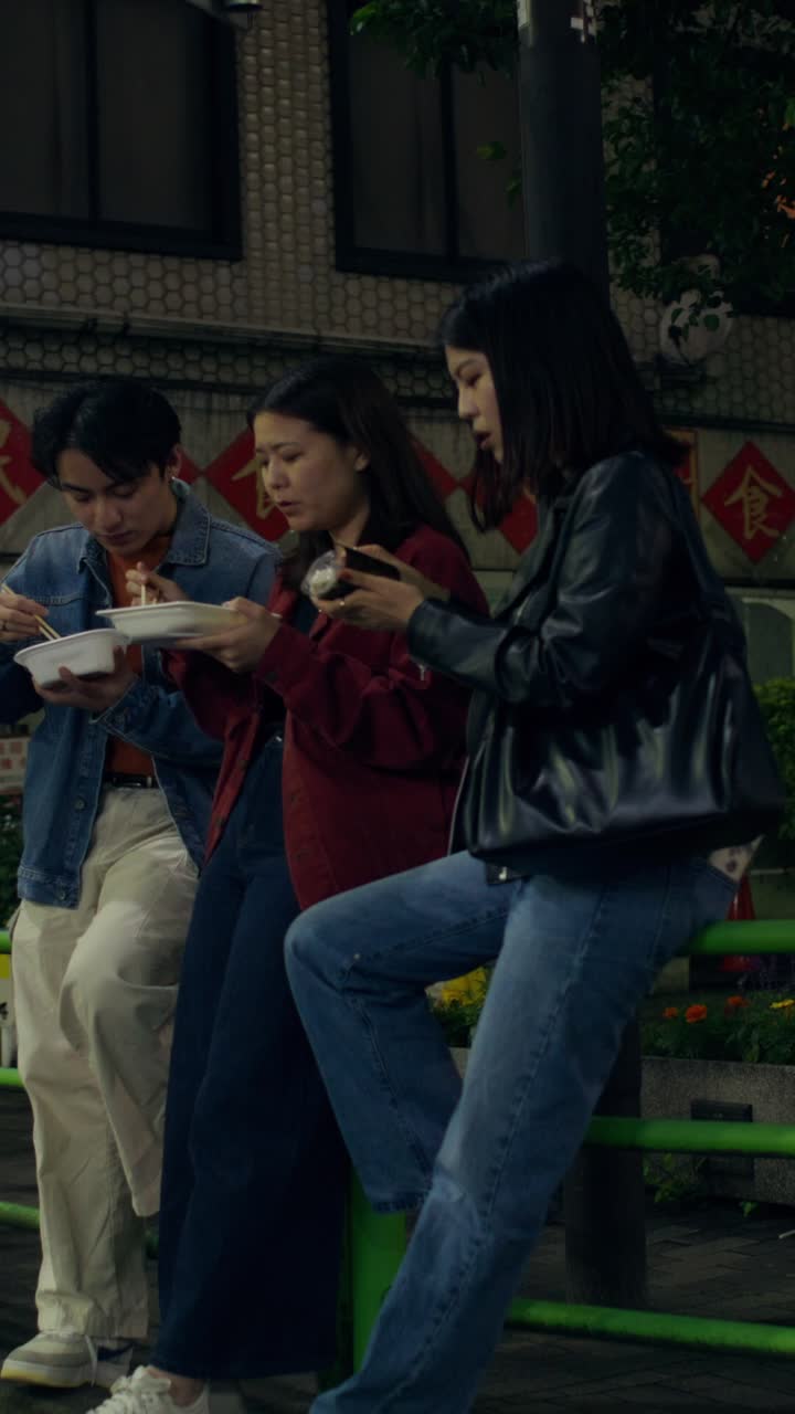 Friends Eating Dinner Outdoors at Night in Japan