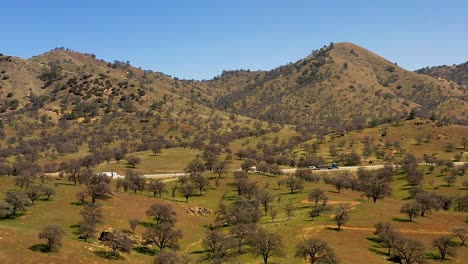 a highway transverses the foothills of the tehachapi mountain range - aerial parallax effect with trippy motion