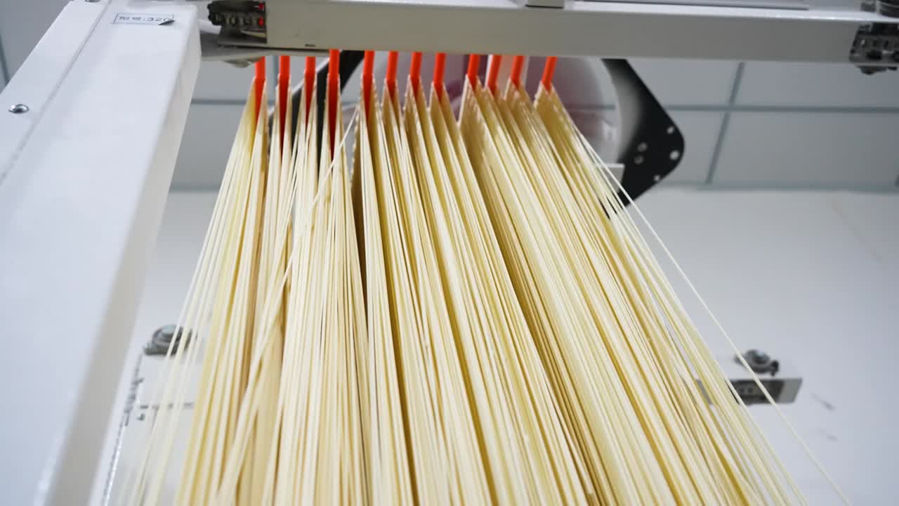 Slow Motion shot of making Traditional Noodles at a factory in Chongqing, China