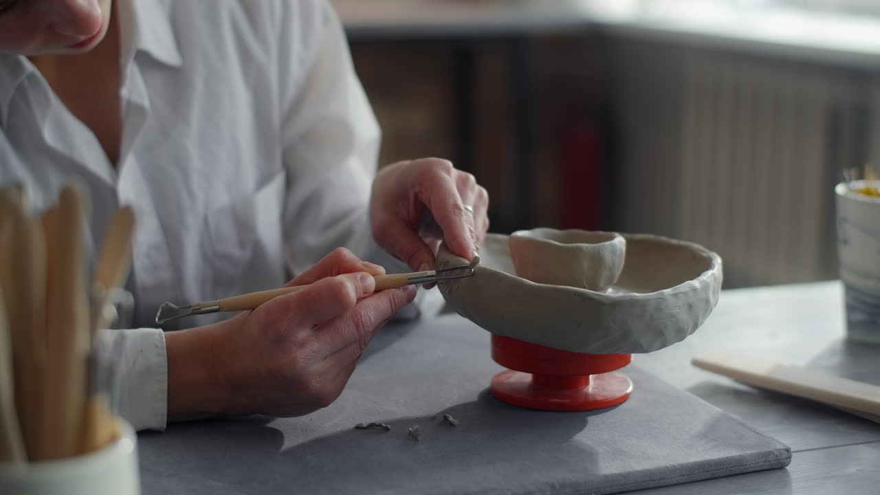 Woman Sculpting a Clay Bowl