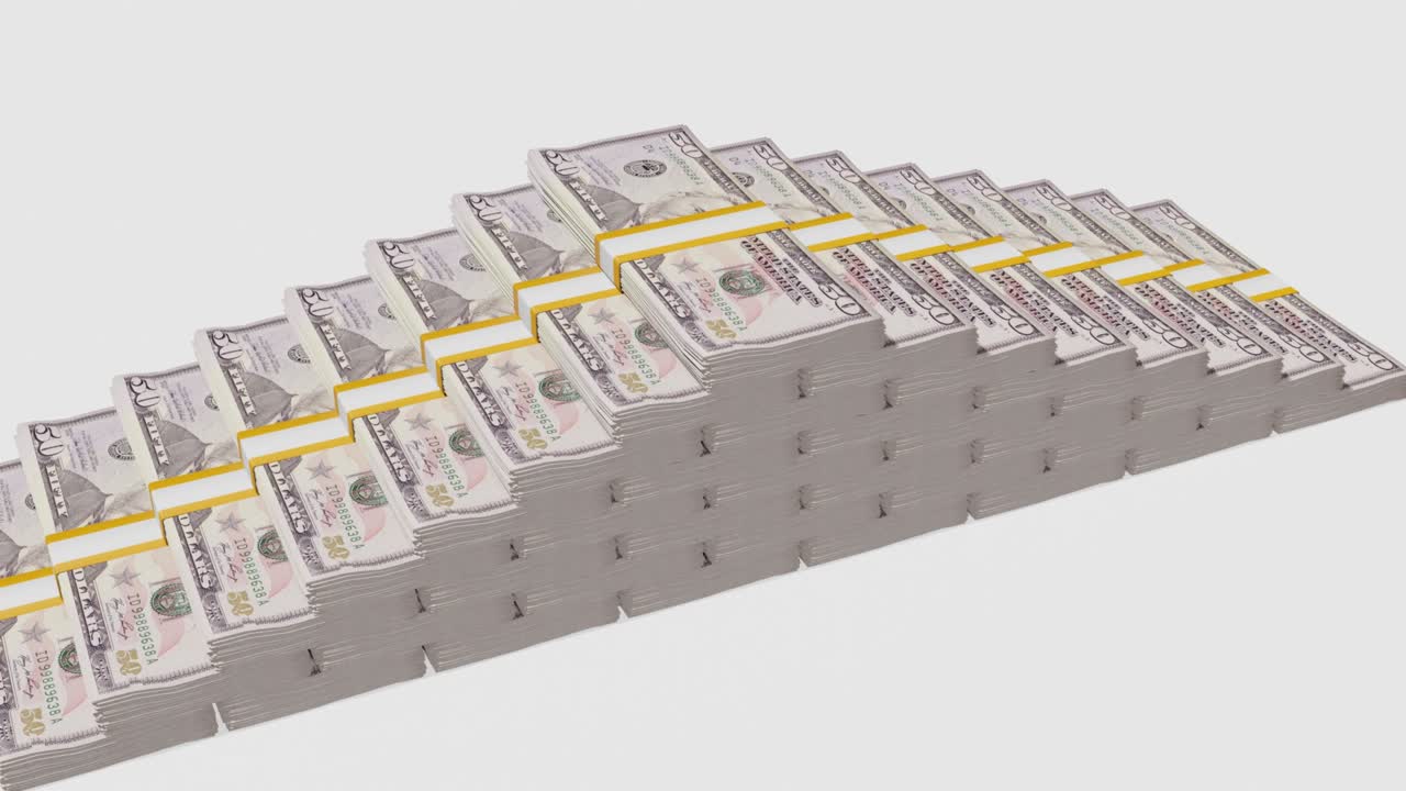 Many wads of money. 50 US dollar banknotes. Stacks of money.
