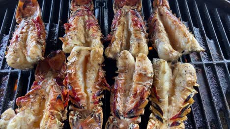 delicious fresh lobster tails on the barbecue grill