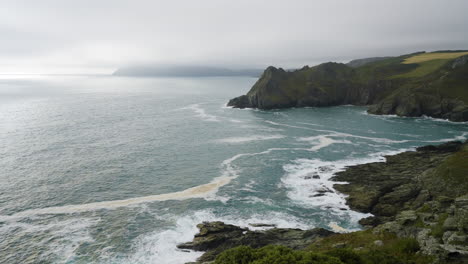coastal view of a rocky bay with waves