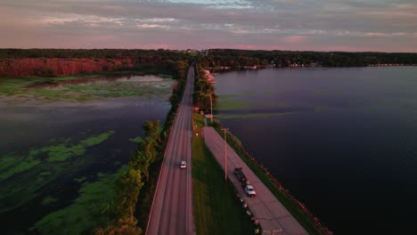 drone view over the road in the green lake inlet boat launch site in ripon, wisconsin, usa.