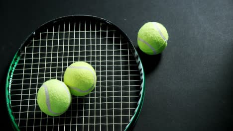 tennis balls and racket in studio 4k