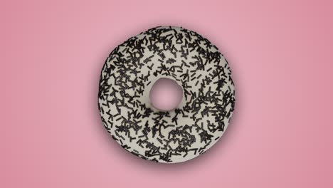 various colorful glazed donuts rotating and changing each other on abstract pink background