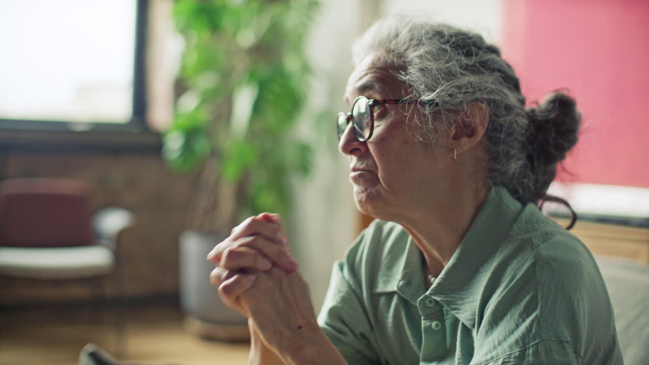 Nervous Senior Woman Having Emotional Conversation with Therapist