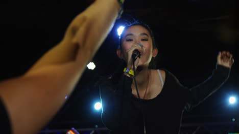 singer performing on stage at a concert 4k