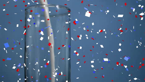 Animation-of-confetti-falling-over-champagne-glass