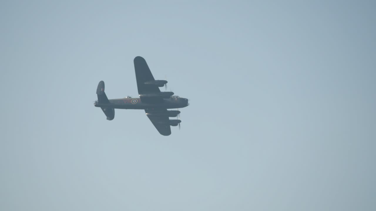In the sky, they twist and glide, historic WWII aircraft, wings open wide