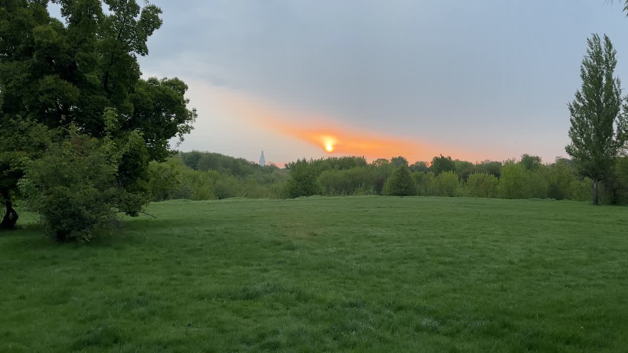 The sun rises against the backdrop of nature and an ancient temple (4K 60 fps)