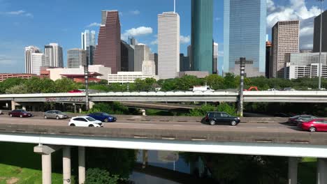 buffalo bayou river water flows to downtown houston skyscrapers in texas