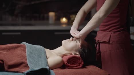 woman receiving facial massage