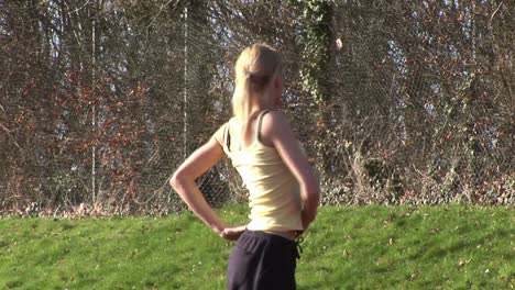 woman running at track and field competition