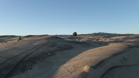 dirt biking at the sand dunes at little sahara recreation area in utah