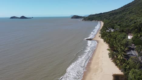 4k drone shot of a beautiful sandy beach a peninsula and a small island