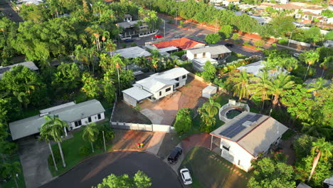 Drone-aerial-flyover-of-an-elevated-house-in-suburban-area