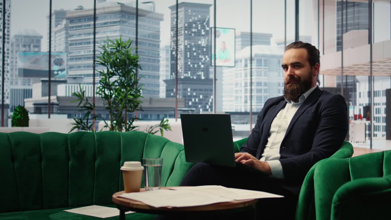 Vertical Video Male leader sitting in a smart office demonstrating authority and productivity