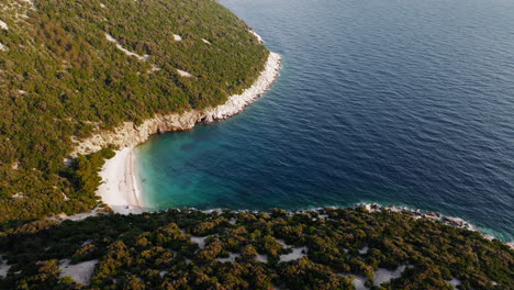 high angle establishing overview of blue lagoon beach cres island croatia