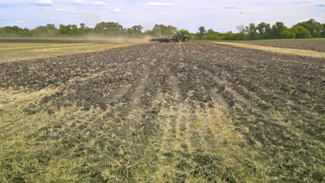 farming tractor working on agricultural field. agricultural tractor on field