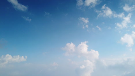 Fluffy-white-clouds-forming-high-up-in-the-mountains-above-Kodaikanal,-Tamil-Nadu