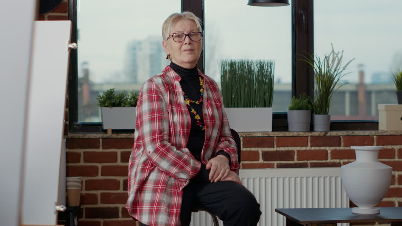 Portrait of elder teacher training art students to draw artistic sketch