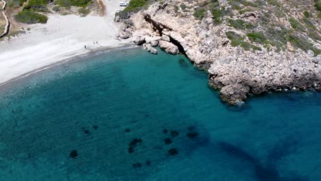 top view of paradisiac rocky fourni beach with crystal clear waters in kythira island, greece