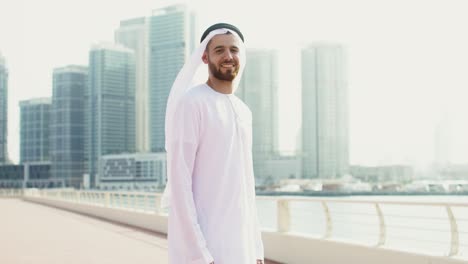 man in traditional emirati clothing in dubai city