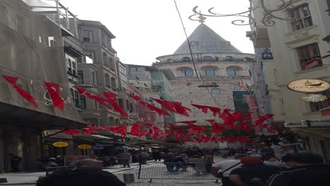 crowded street in istanbul leading to galata tower