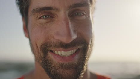 close-up-portrait-of-attractive-young-man-smiling-happy-looking-at-camera-enjoying-sunny-outdoors-lifestyle