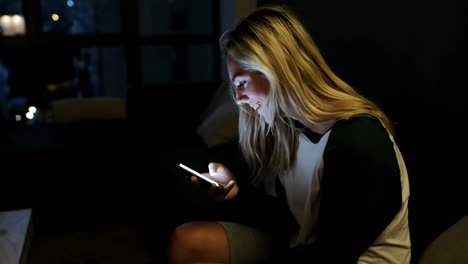 woman using mobile phone at home 4k