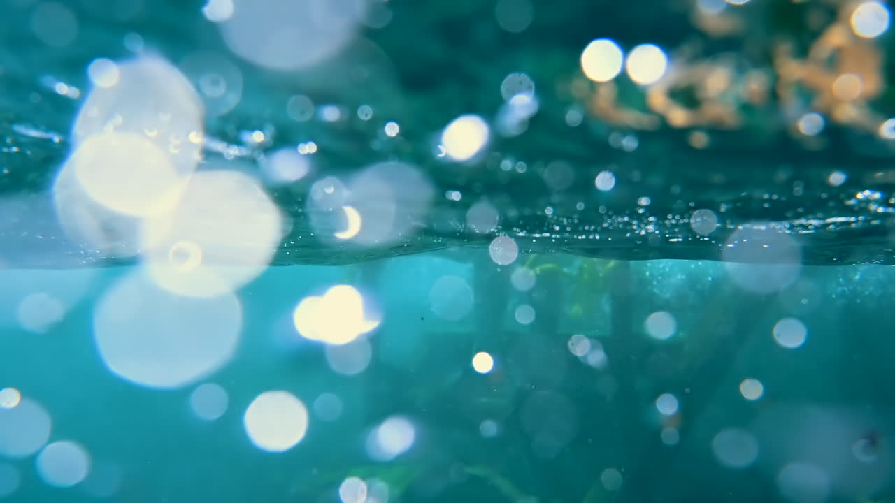 Underwater view of the waves and the bubbles of the red sea