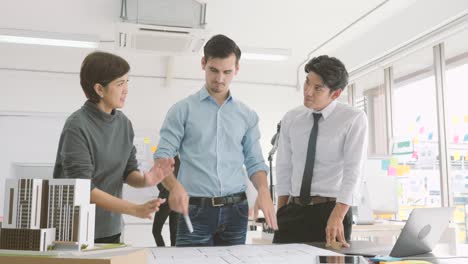 team of creative architects working together in a architect studio