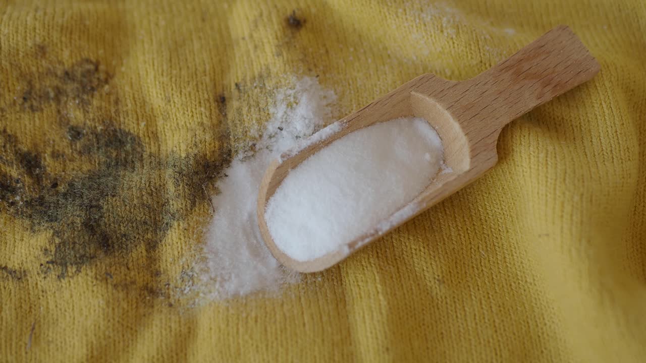 Baking Soda for Stain Removal on Yellow Sweater