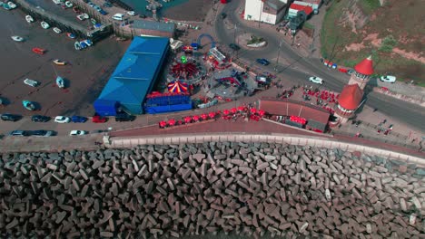 aerial shot of street and rocks of sea with piegon bath corner in scarborough uk