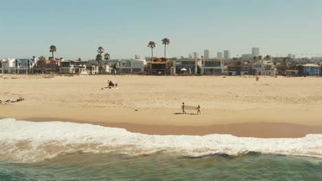 beautiful aerial drone of california coastal beach with surfers - graded